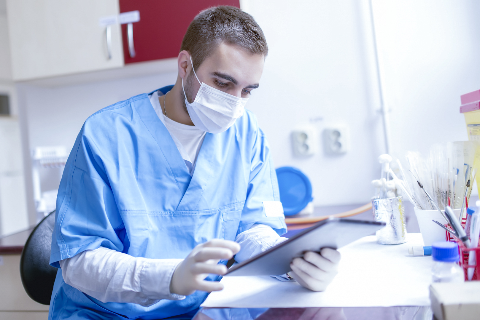 research scientist looking at the tablet, using technology for b